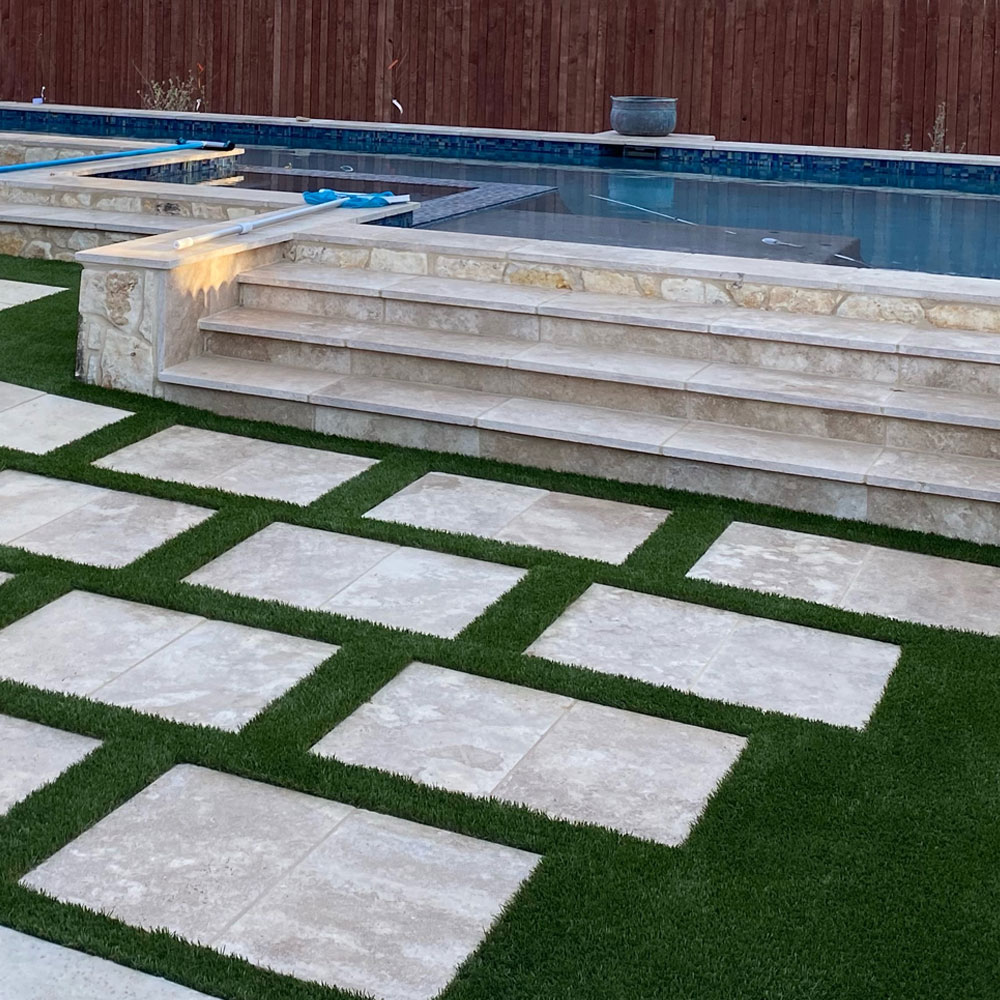Synthetic turf around swimming pools reduces maintenance.