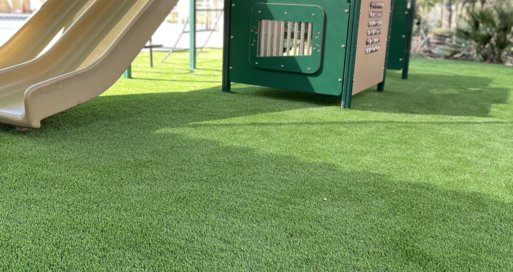 Kid-friendly playscape with synthetic grass by Ultimate Turf Solutions serving San Antonio, New Braunfels, and Fair Oaks Ranch